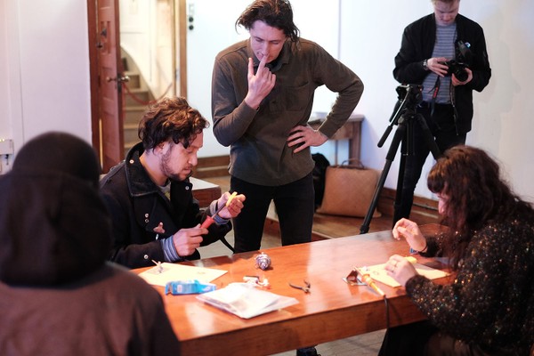 A man talking to a group of people.