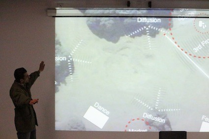 A man giving a Powerpoint presentation.