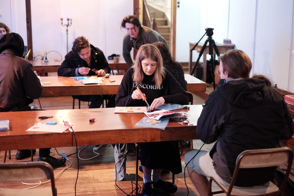 Various people at desks.