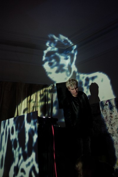 A man standing in a projection.