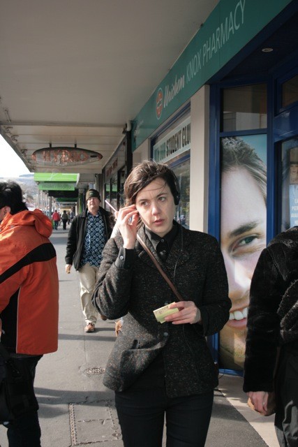 A woman walking down the street.