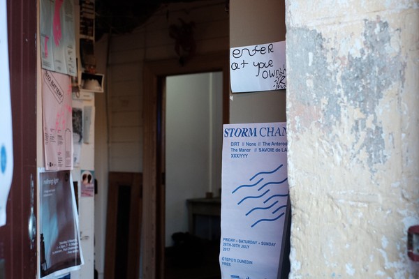 An entranceway with posters of the wall.